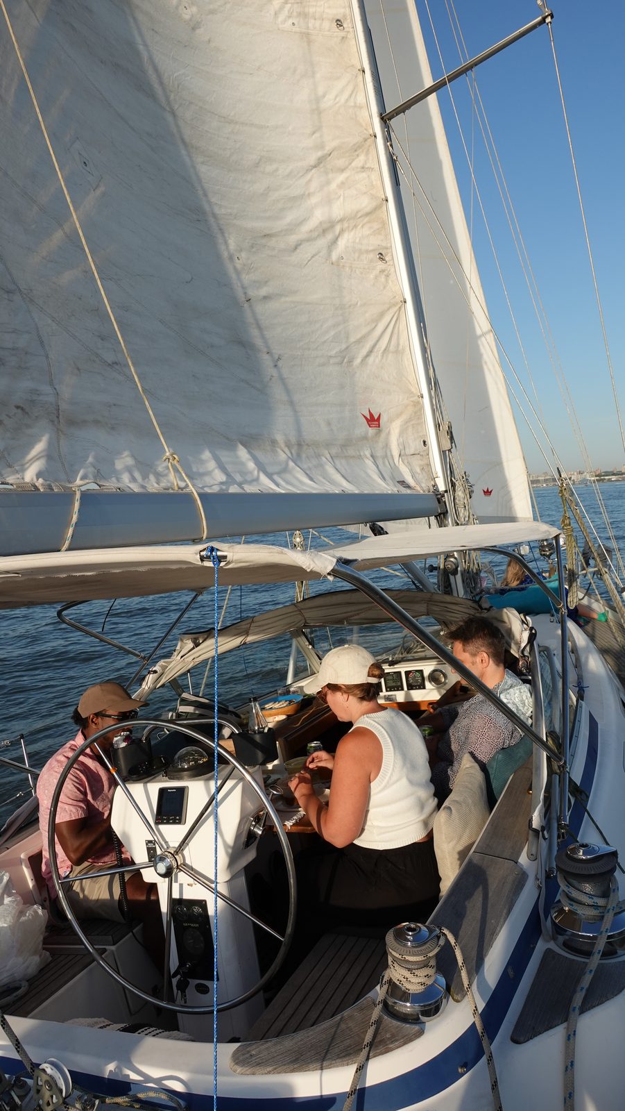 Guests relaxing on a private Jersey City sailboat charter